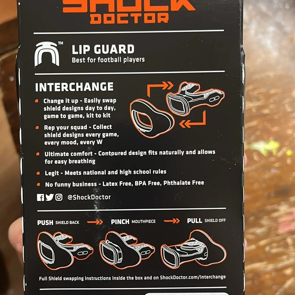 Shock dock lip guard protection for sports